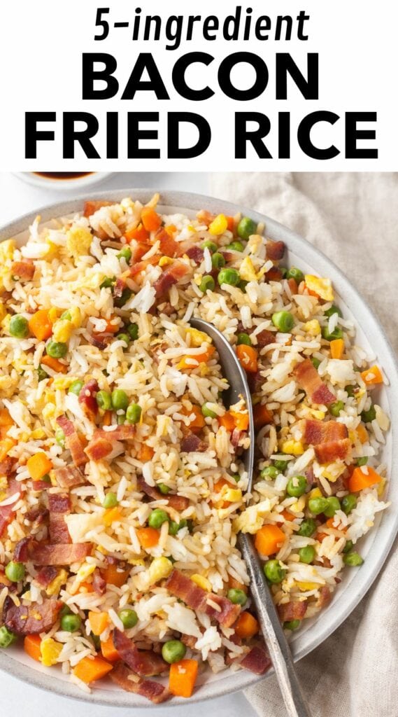 pin for bacon fried rice with a white box with black text at the top reading "5-ingredient bacon fried rice" and a picture of the fried rice in a gray bowl with a silver serving spoon in it on the bottom ¾ of the pin image.