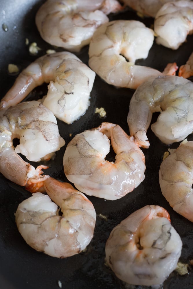shrimp cooking in a pan