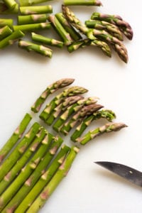 cutting asparagus into 1 inch pieces