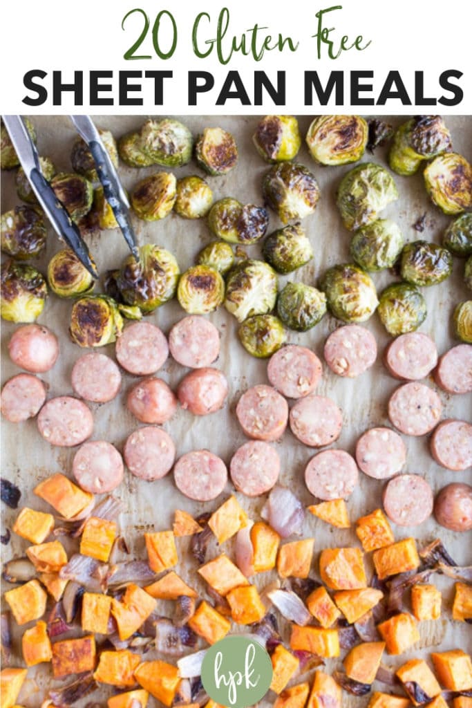 Pinterest pin for sheet pan dinners showing a top down shot of an example sheet pan dinner with sweet potatoes, red onions, sliced sausage, and Brussels sprouts, with a pair of tongs in the corner.