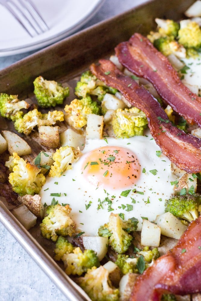 veggies, egg, and bacon on a sheet pan
