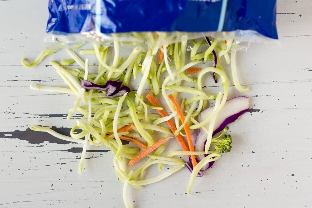 picture of broccoli slaw coming out of it's bag.