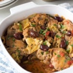 greek chicken thighs in a square dish