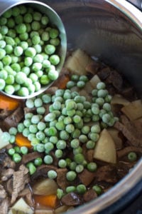 pouring frozen peas in an instant pot