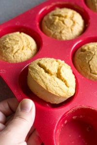 popping gluten free cornbread muffins out of silicone pan