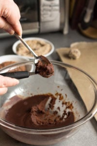making a chocolate truffle with spoons