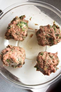 paleo meatloaf muffin mixture separated into 4 sections in a bowl