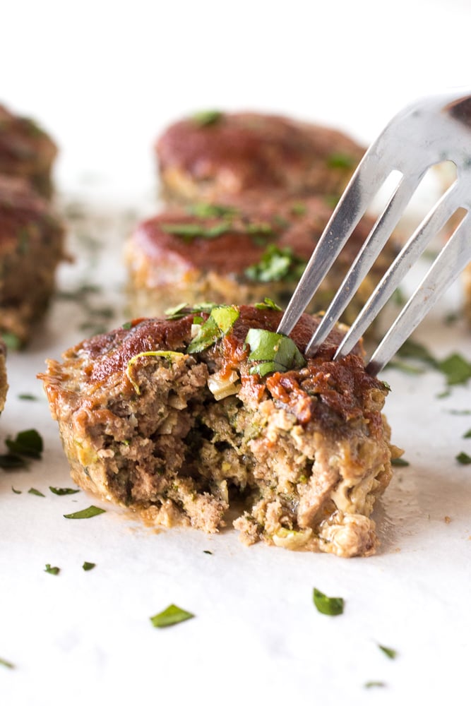 a fork taking a piece of paleo meatloaf muffins