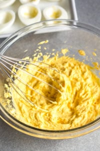 whipping egg yolk mixture with a whisk