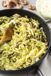ground beef and cabbage stir fry in a pan