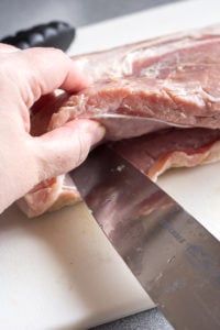 making a pocket in a pork roast with a knife