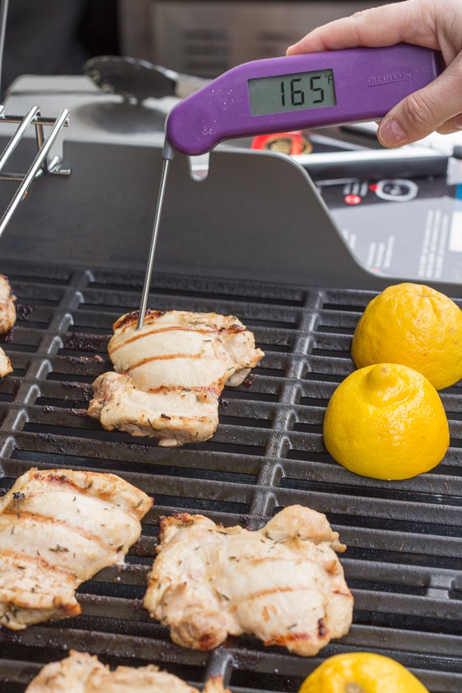 measuring internal temperature of grilled chicken