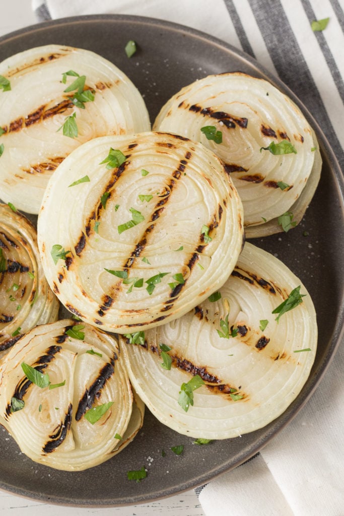 perfectly grilled onion on a platter