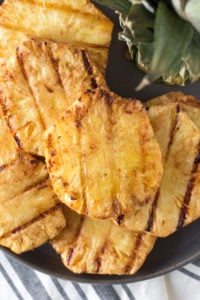healthy grilled pineapple slices on a plate