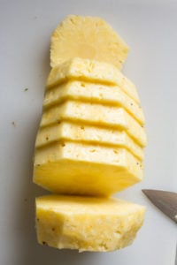 slices of pineapple on a cutting board