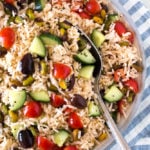 bowl of greek rice salad with a spoon