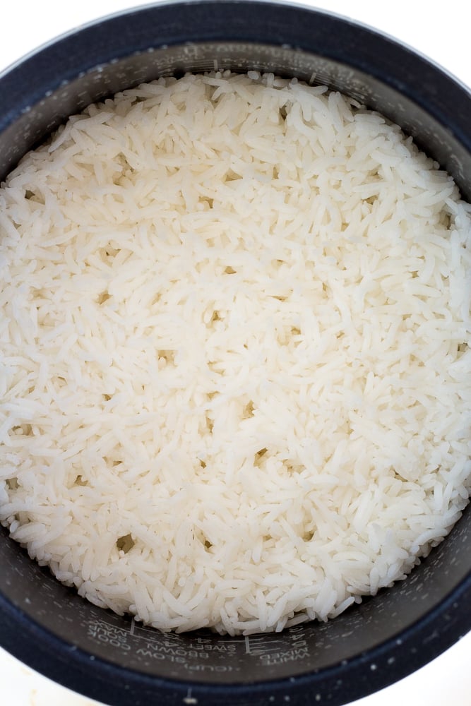 Top down shot of cooked rice in a cast iron bowl.