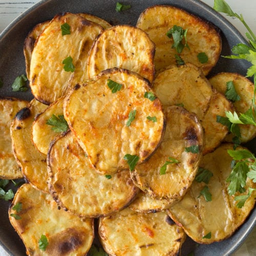 a plate of grilled potatoes