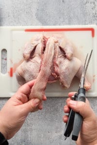 removing the backbone from a raw chicken