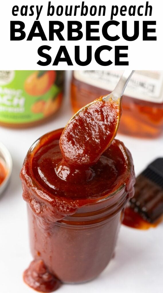 Pinterest image with black text on a white background at the top that reads "easy bourbon peach barbecue sauce" and an image showing a spoon dipping into a mason jar with bbq sauce in it surrounded by a lid, a bbq brush, a jar of peach preserves, and a bottle of Jim Beam bourbon.