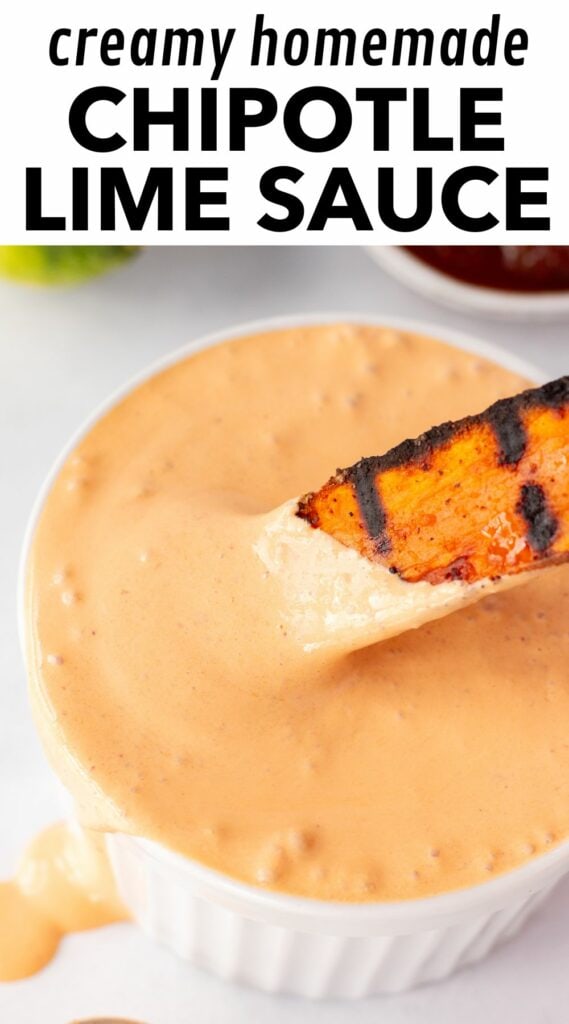 Pinterest image showing a picture of a grilled sweet potato wedge being dipped in a white bowl containing an orange chipotle sauce. Black text on a white background at the top reads "creamy homemade chipotle lime sauce".