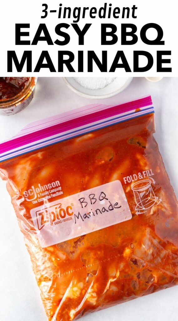 Pinterest image showing a top down shot of a ziploc bag with raw boneless chicken thighs in a red bbq marinade in it, with a small bowl of kosher salt and a jar of bbq sauce at the top of the frame. At the top is black text on a white background that reads "3-ingredient easy BBQ marinade".
